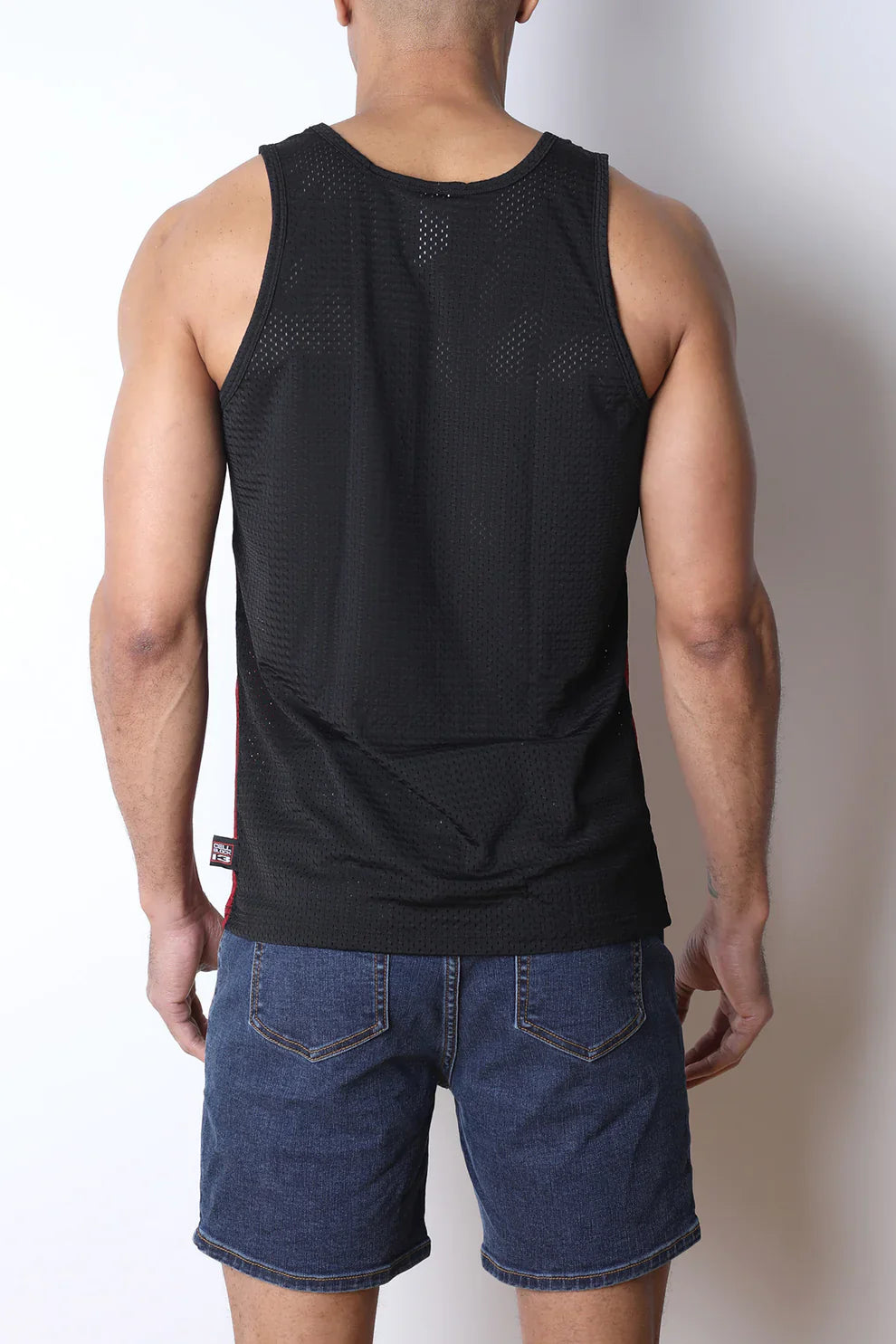 Black starter mesh tank top with subtle perforated texture and small brand tag at the bottom hem