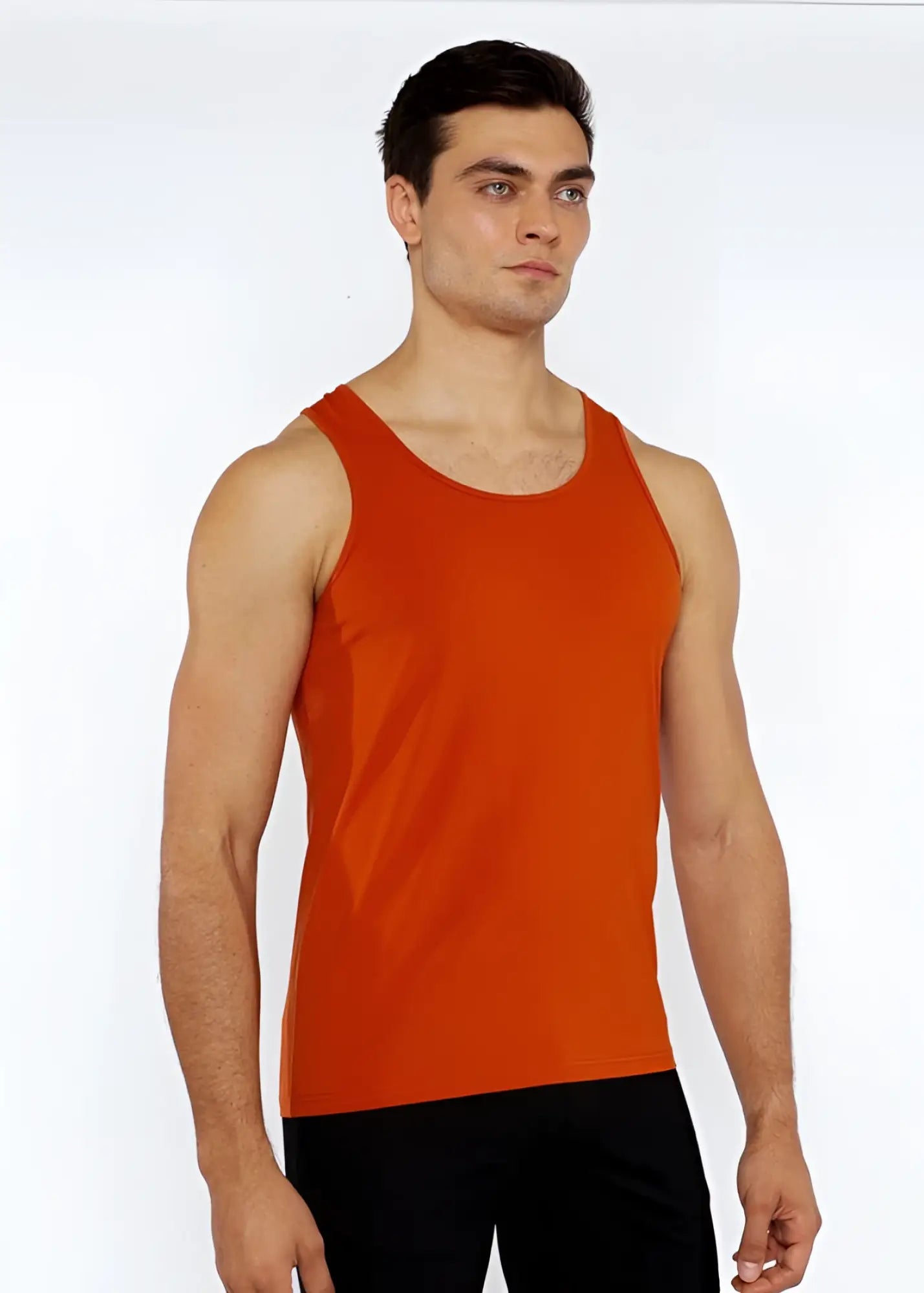 Orange sleeveless athletic tank top made of stretch jersey with circle spine laser cut detail for active wear