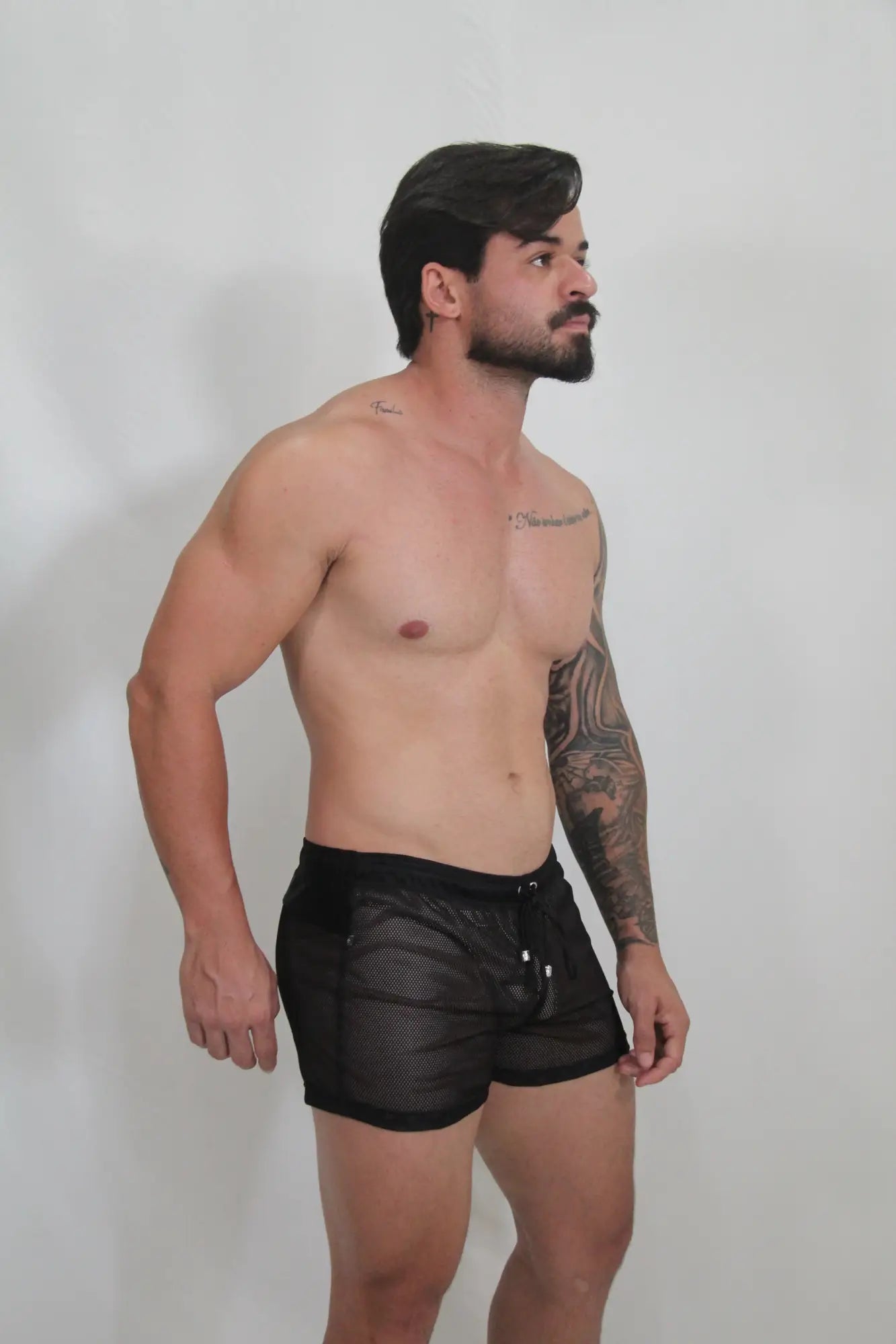 Black mesh swim trunks with a drawstring waistband from the circuit mesh short collection in 4 colors available