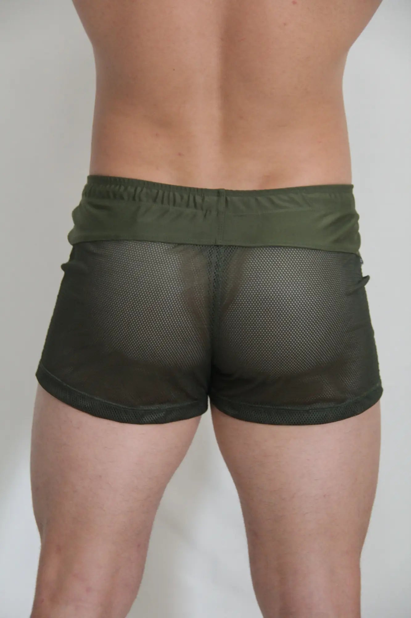 Olive green circuit mesh shorts with solid elastic waistband made of breathable mesh material for active wear