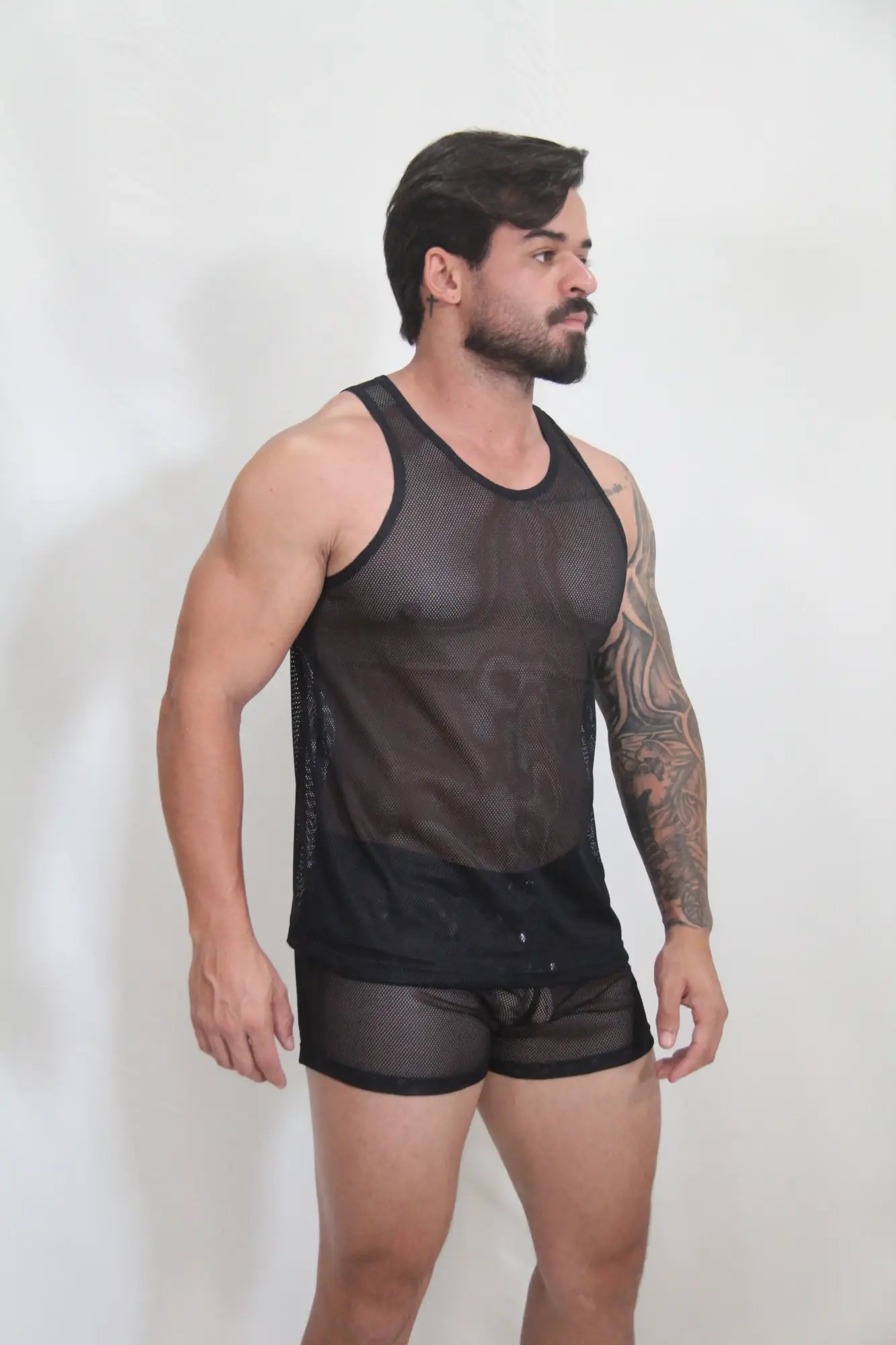 Black mesh tank top with solid black bottom hem and side panels from circuit mesh tanks available in 4 colors