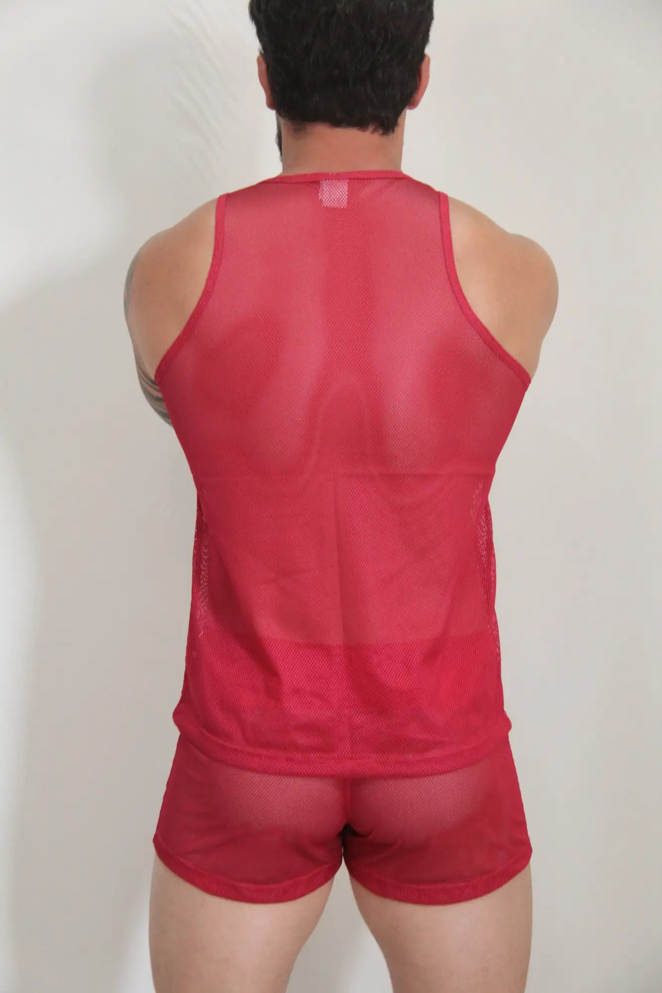 Red mesh tank top and matching shorts set featuring breathable circuit mesh fabric in vibrant red color