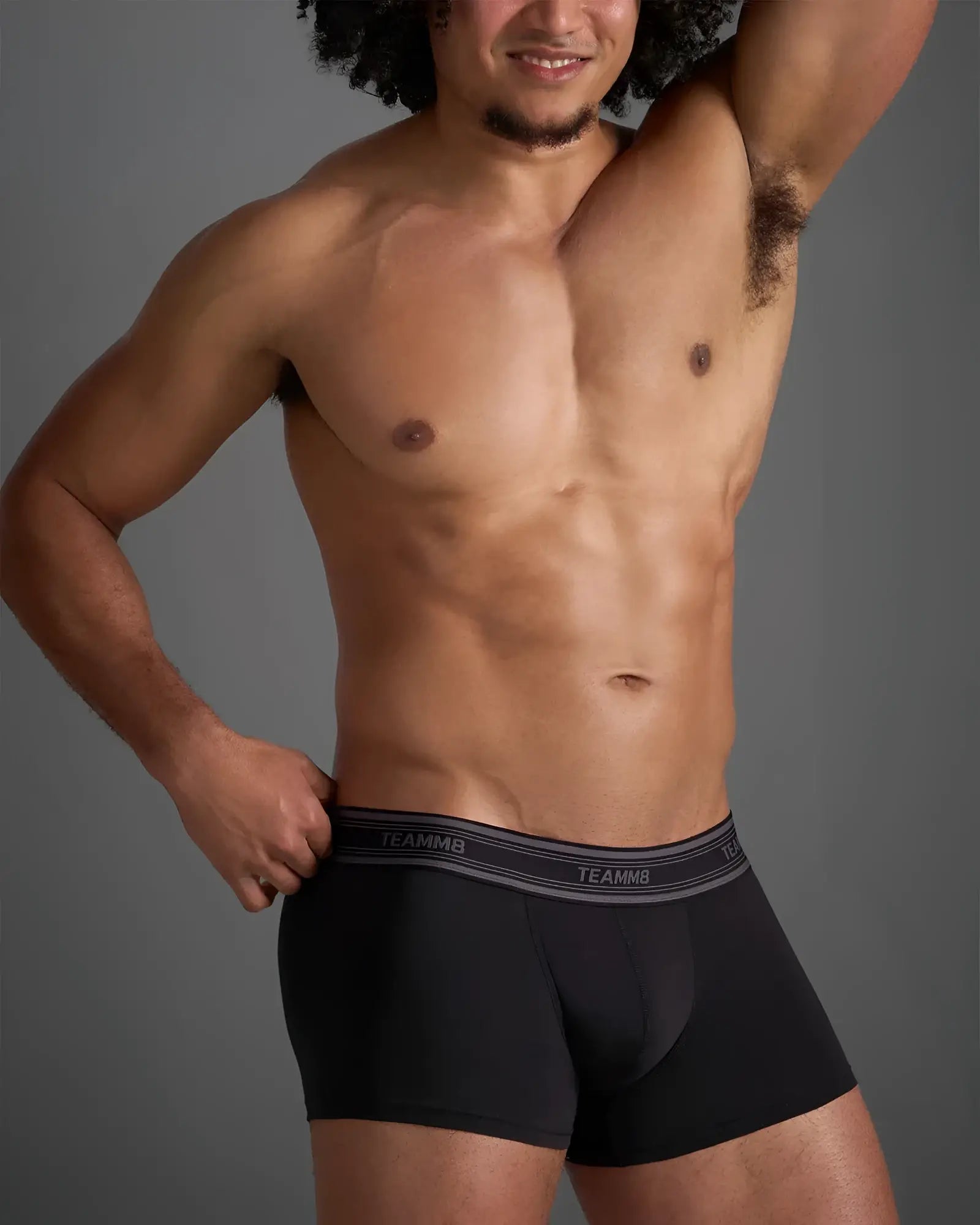 Black classic cotton trunk boxer briefs with gray elastic waistband featuring white brand name lettering