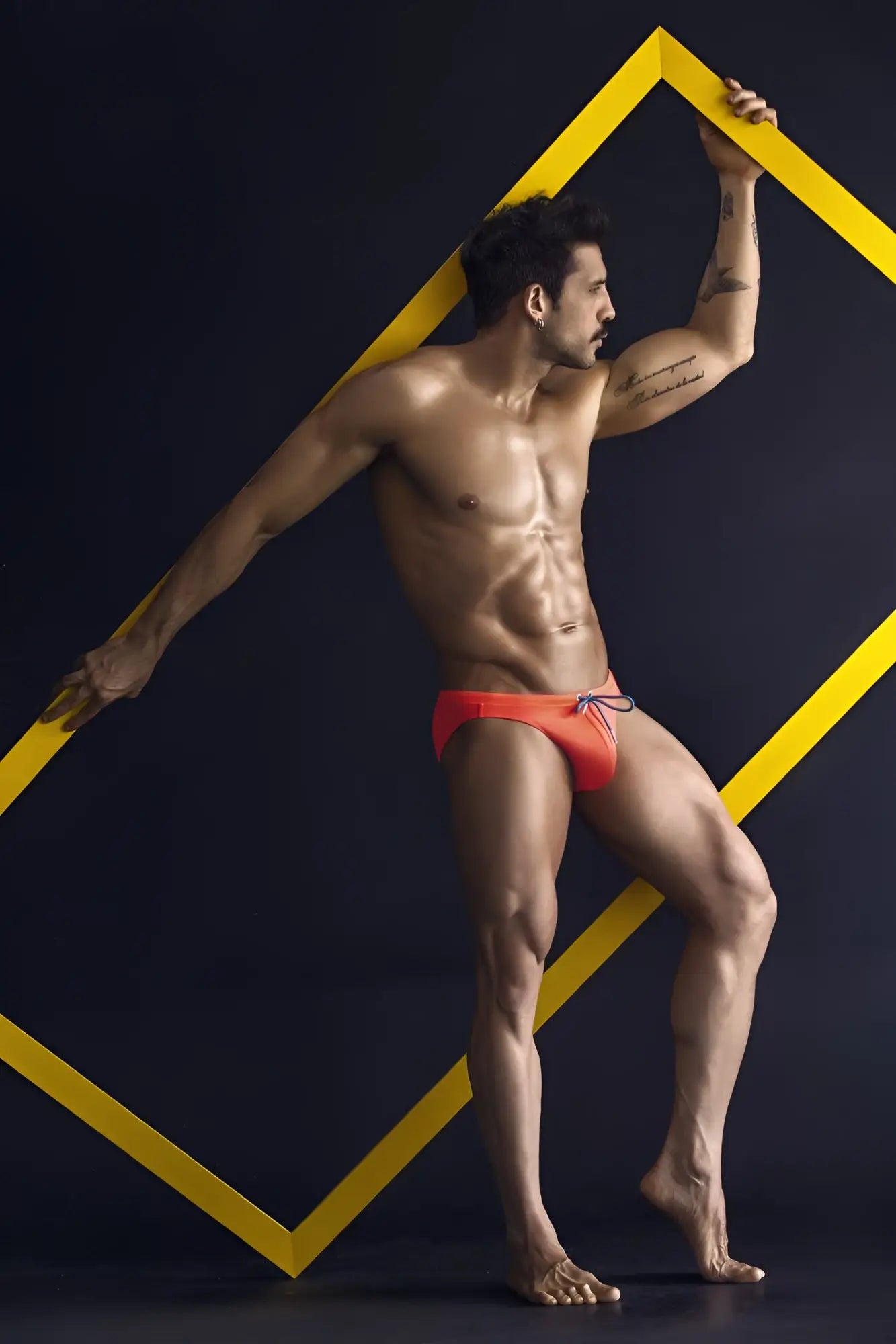 Orange clever 1735 vivo swim briefs featuring a drawstring waistband designed for comfortable swimming use