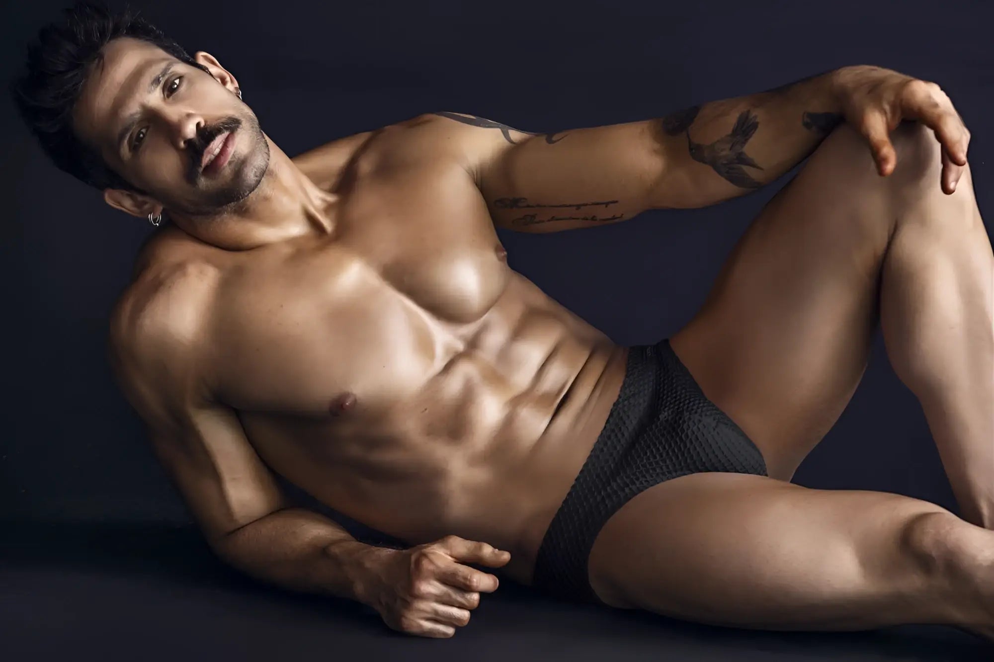 Black clever 1743 island swim briefs made of textured fabric showing front side for swimming and beachwear
