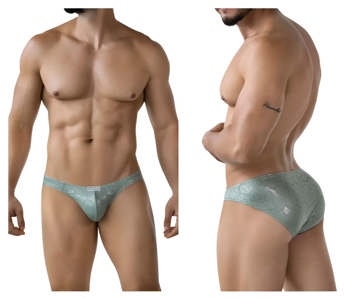 A sleek light teal lace trimmed clever 2040 luxe brief with shimmering pattern and white brand tag at the waistband