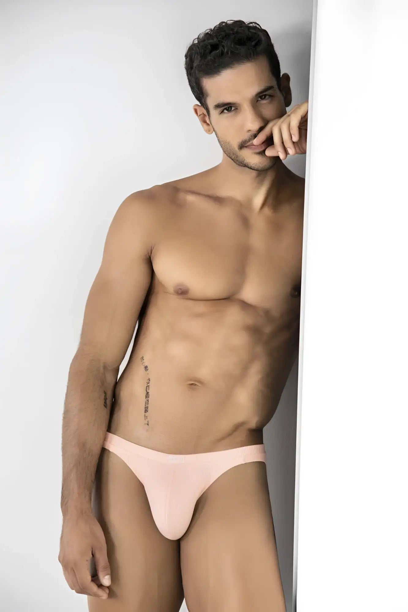 A sleek light pink ribbed cotton brief with a snug fit and minimal design for bold comfort and style