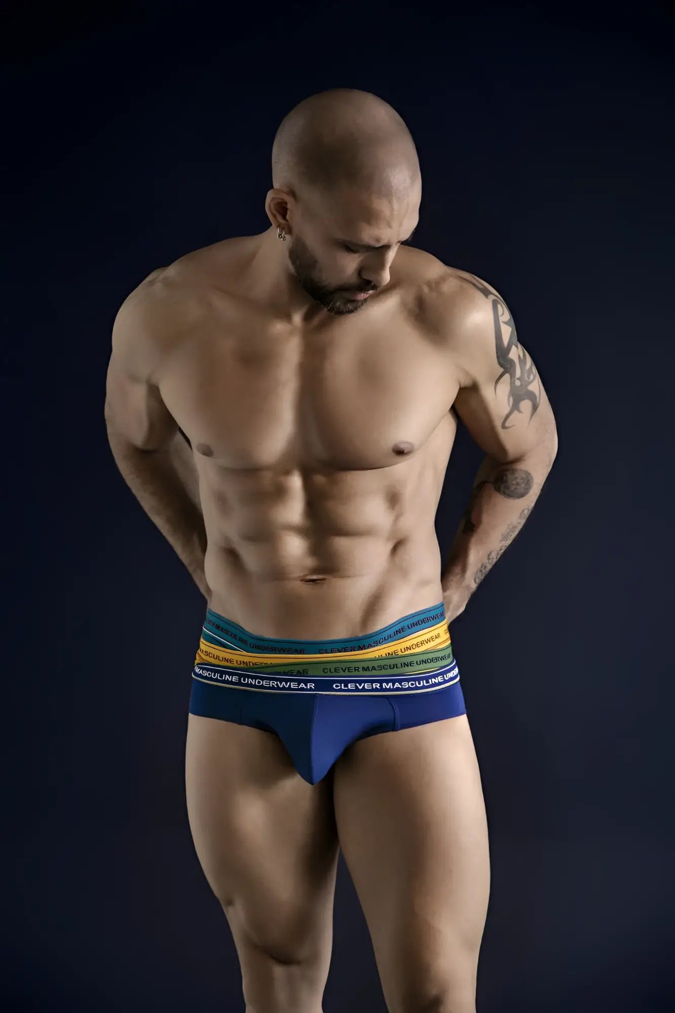 Blue and rainbow-striped clever masculine underwear designed as australian latin briefs in blue, petrol, and green colors