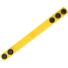 Bright yellow silicone cock strap wristband with four black snap buttons and subtle embossed logo