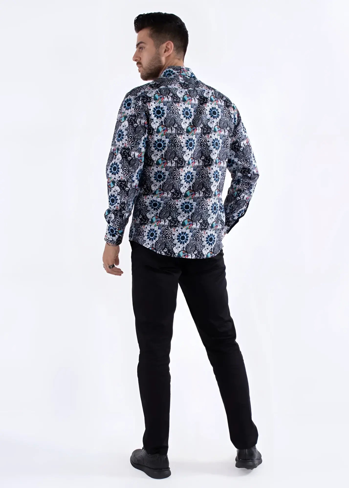 A man wearing a colored shapes print long-sleeved shirt with navy white and muted blue geometric floral pattern