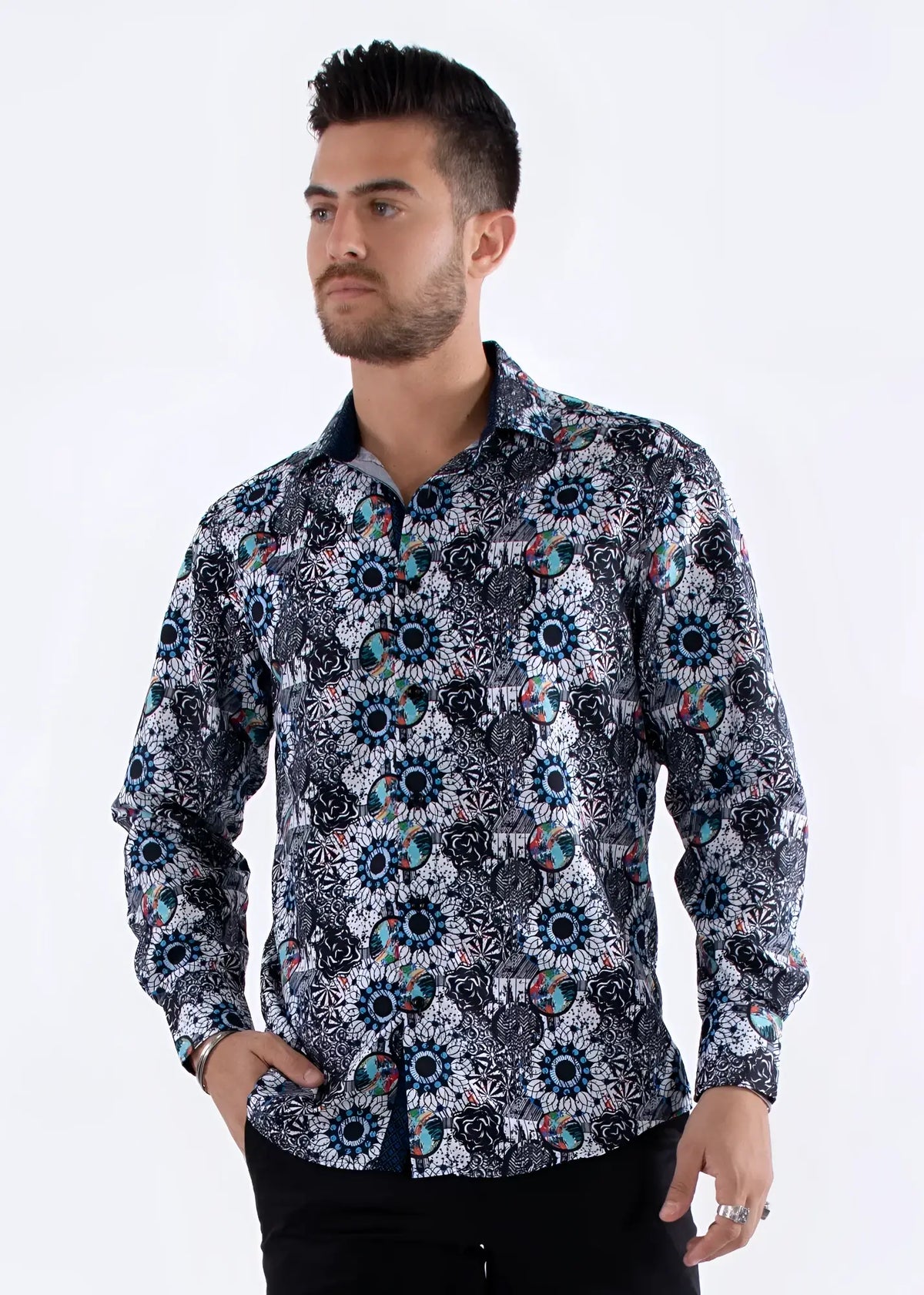 A men’s long-sleeved button-up shirt with a bold geometric floral pattern in navy blue teal black white and pink