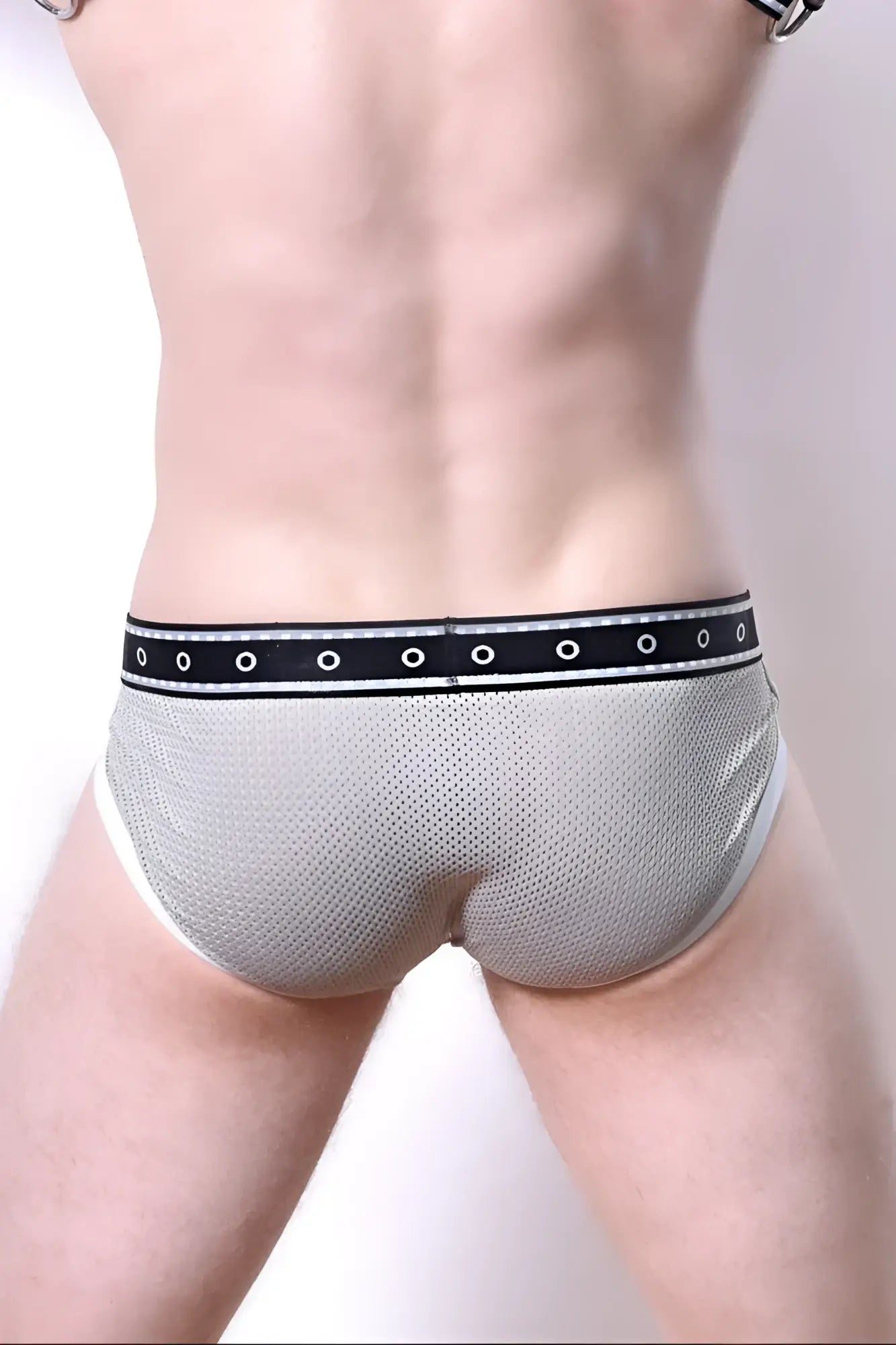 Comicaze brief gray mesh briefs with black waistband featuring white circular eyelets front view