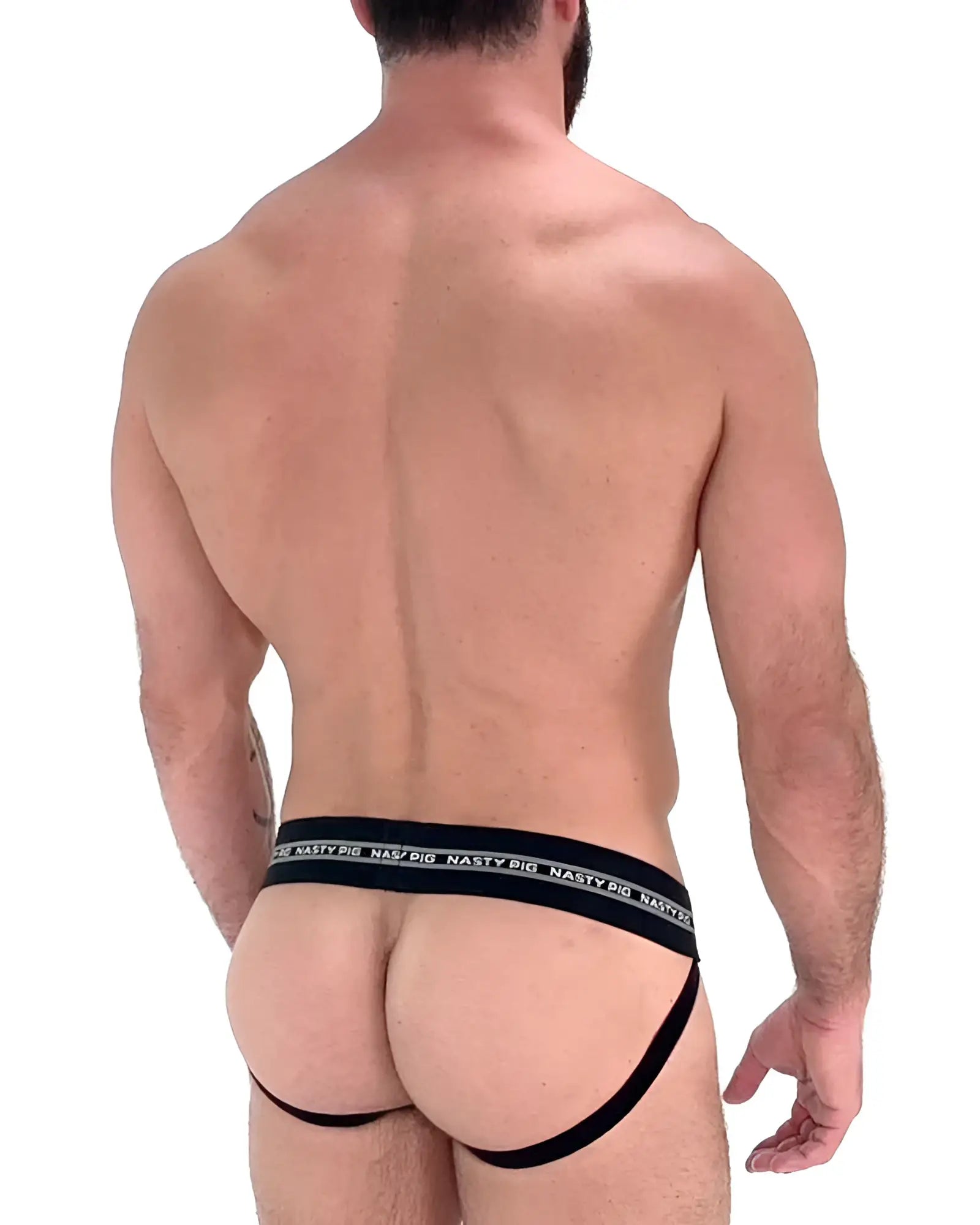 Black nasty pig branded core jockstrap briefs with wide elastic waistband and thin leg straps showing the back side