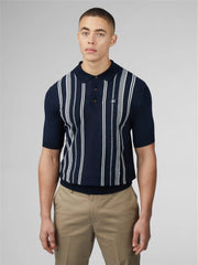 Navy blue crinkle cotton short-sleeved polo shirt with white vertical stripes and small embroidered chest logo