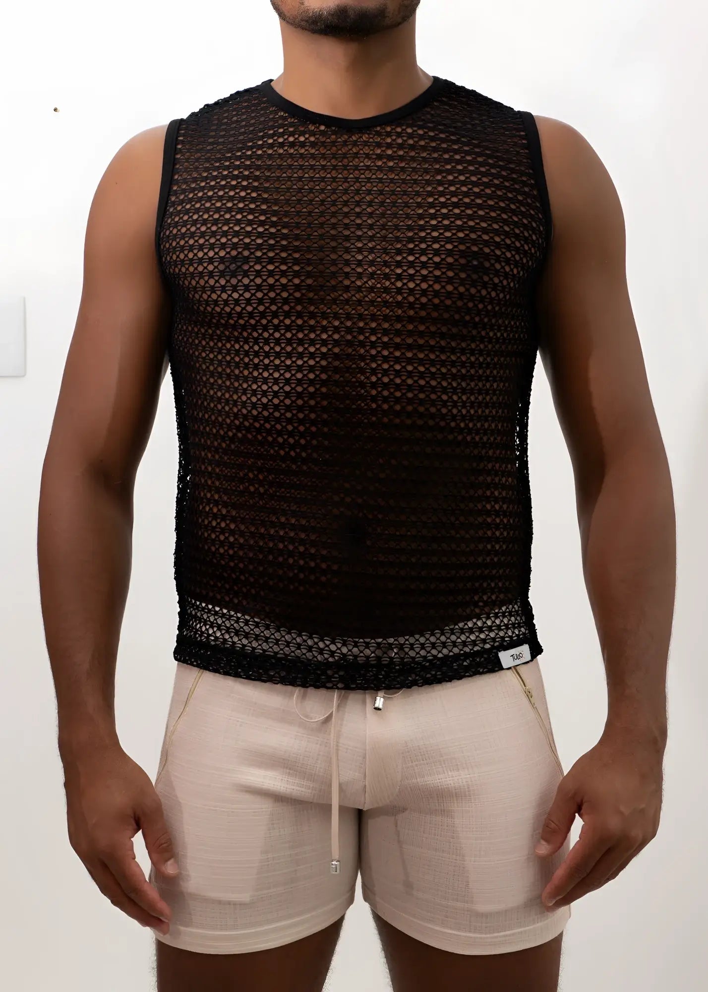 Black crochet muscle tank top with sleeveless mesh design round neckline and elasticated hem for casual wear