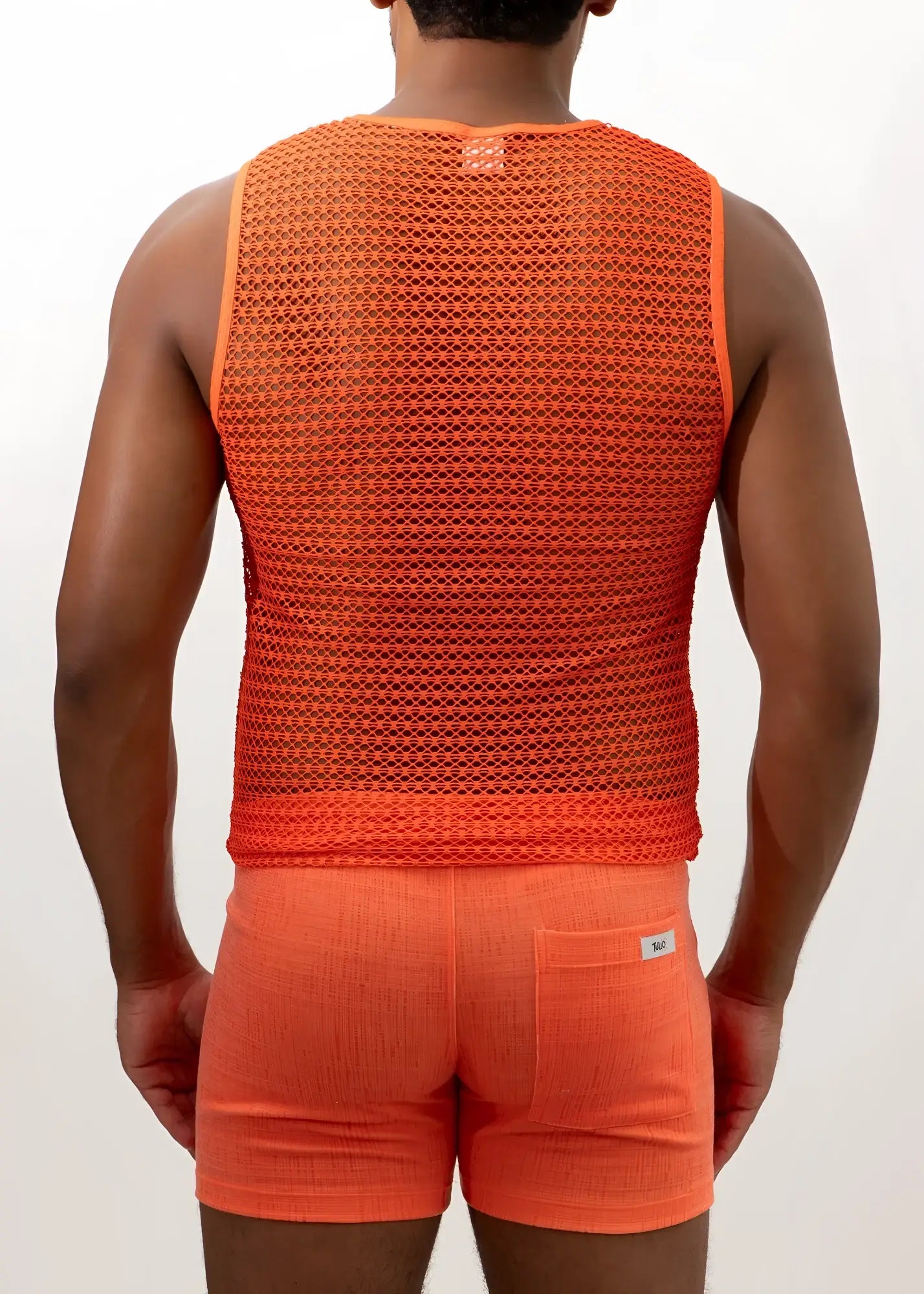 Crochet muscle tank top in orange mesh with textured breathable fabric and a small brand tag at the neckline