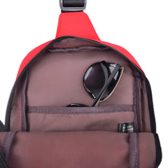 Red nylon crossbody canvas sling bag with black zipper and adjustable strap for hands-free carrying