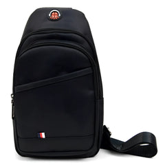 Black nylon crossbody sling bag with red and white circular logo and small flag emblem on front