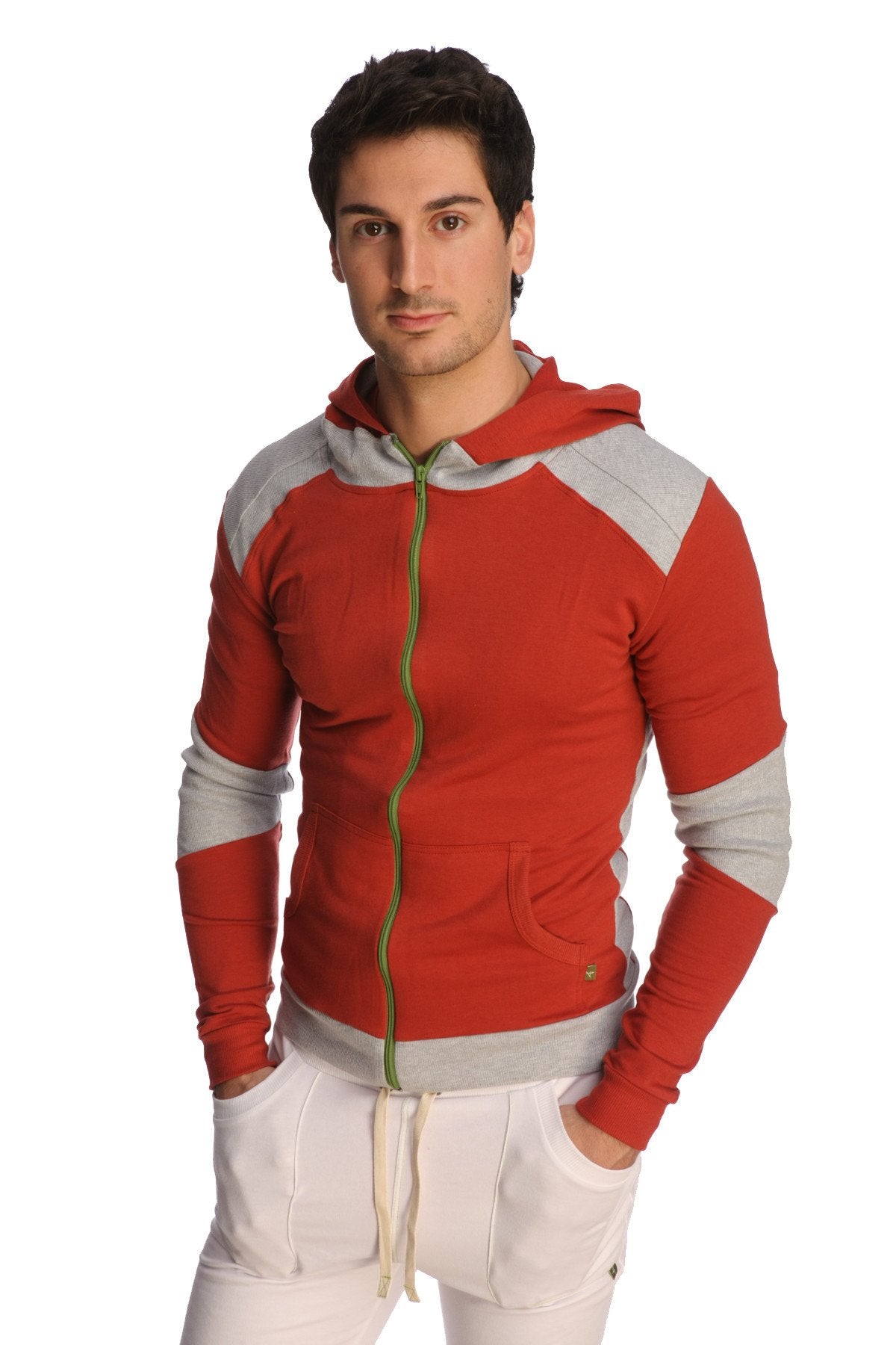 Form-fit crossover yoga track performance hoodie in cinnabar grey with red and gray panels, green zipper pull, and pockets