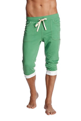 Green cuffed yoga pants in bamboo fabric featuring white drawstring and contrasting white cuffs in capri length