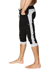 Black and grey cuffed yoga pants with side stripe elastic waistband and rolled cuffs for athletic wear