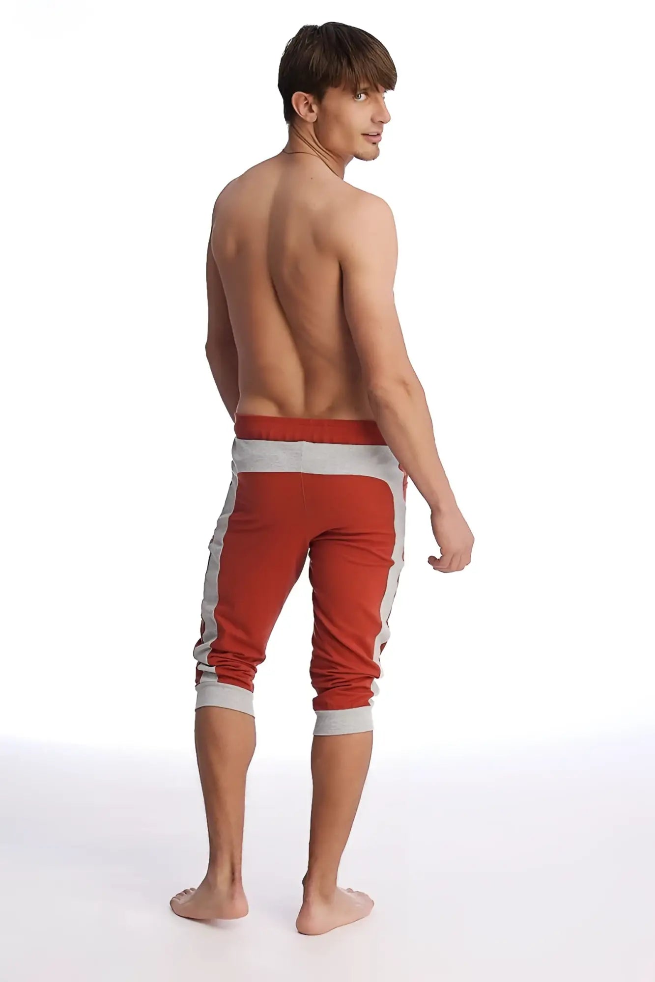 Cuffed yoga pants in cinnabar and grey featuring ribbed cuffs and a comfortable athletic capri design