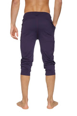 Dark purple cuffed yoga capri pants with stretchy fabric and elastic waistband for comfortable movement