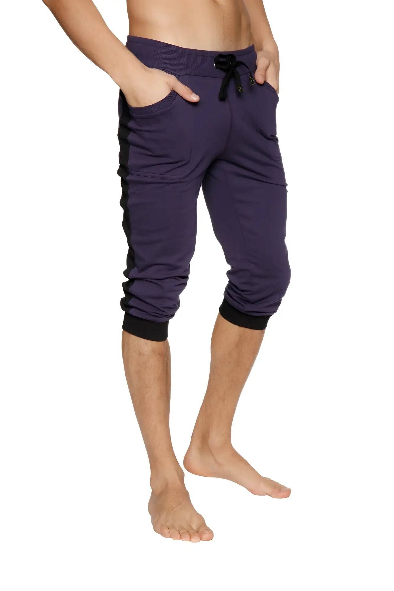 Eggplant cuffed yoga pants with black side panels elastic cuffs and drawstring waistband in capri length