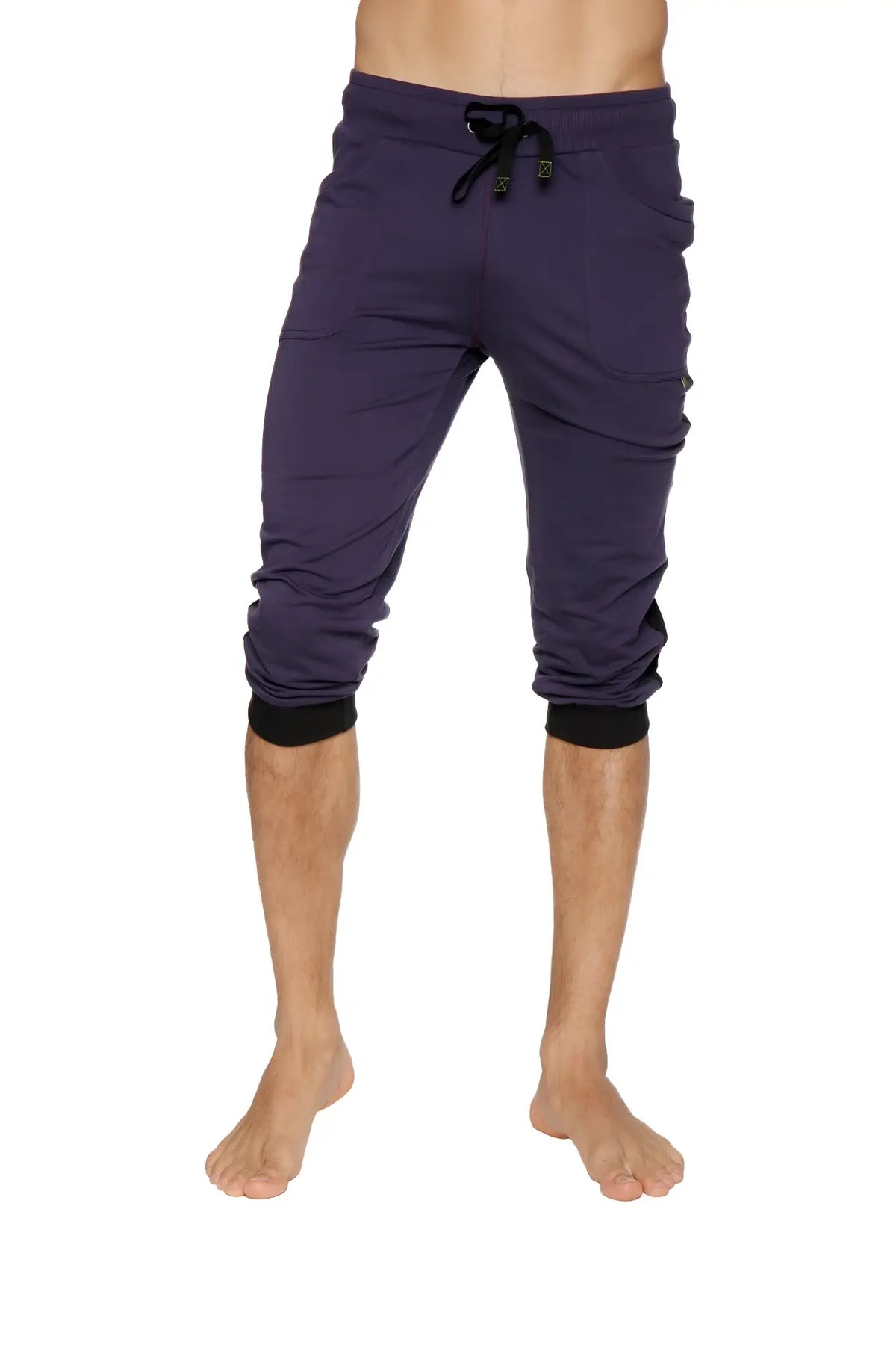 Dark purple capri-length cuffed yoga pants with black drawstring waistband and elastic cuffs for active wear