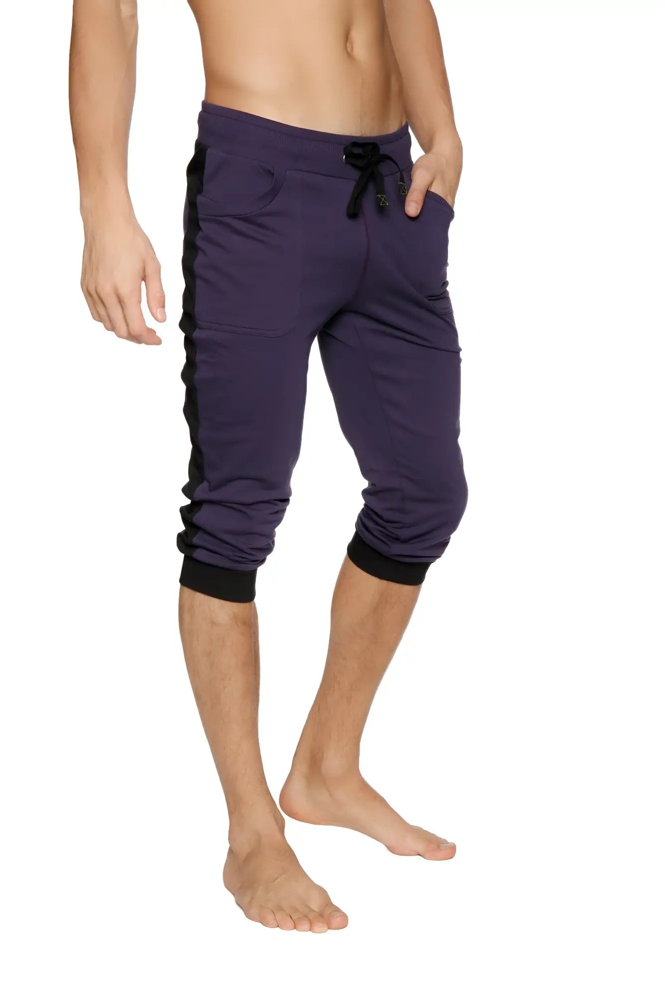 Cuffed yoga pants in eggplant with black side panels featuring elastic cuffs and capri-length jogger style