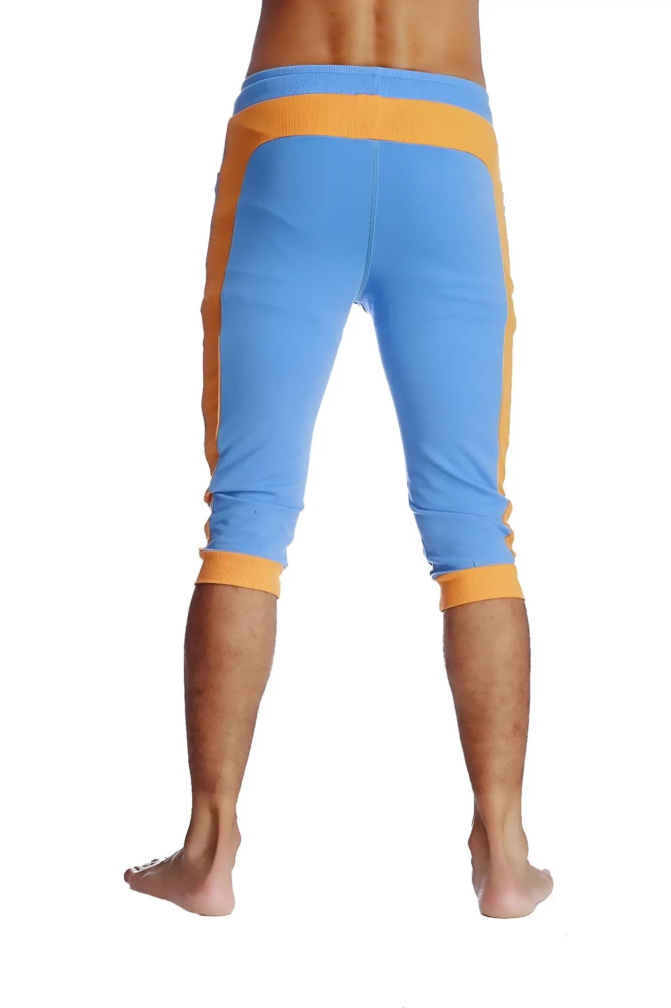 Cuffed yoga pants in ice blue with orange featuring ribbed waistband and cuffs in capri-length athletic style