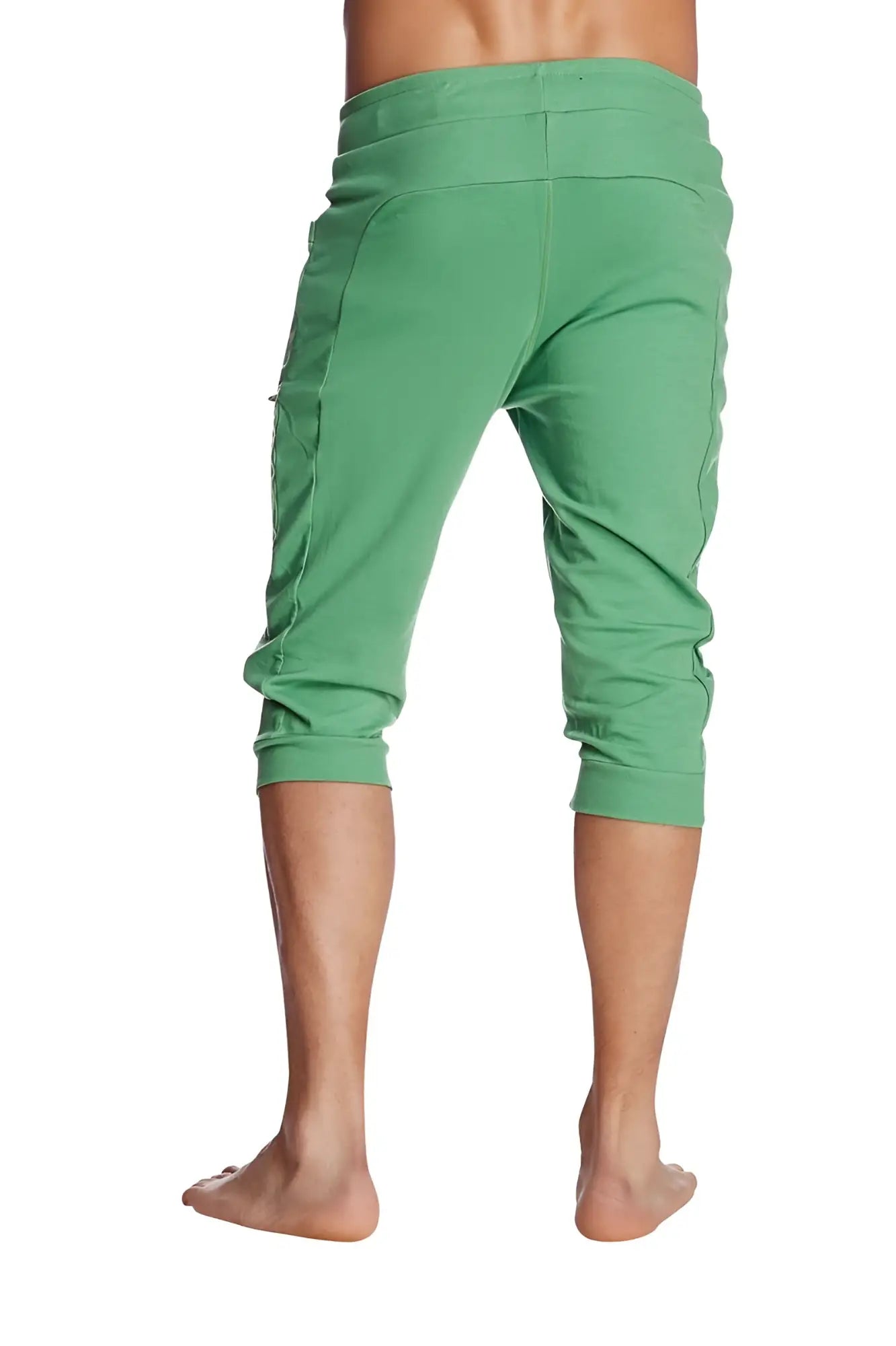 Green cuffed yoga pants made from solid bamboo fabric with elastic waistband and side pockets for comfortable wear