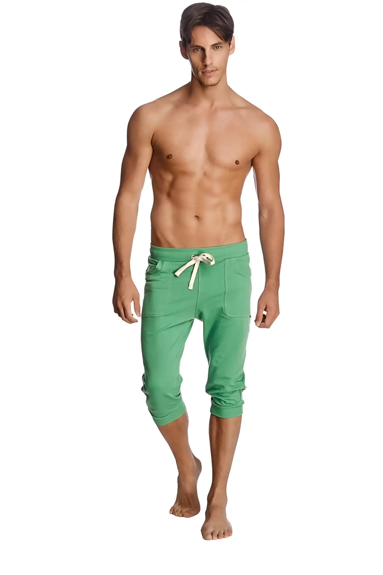 Cuffed yoga pants in solid bamboo green with capri length, white drawstring, and side pockets for comfort
