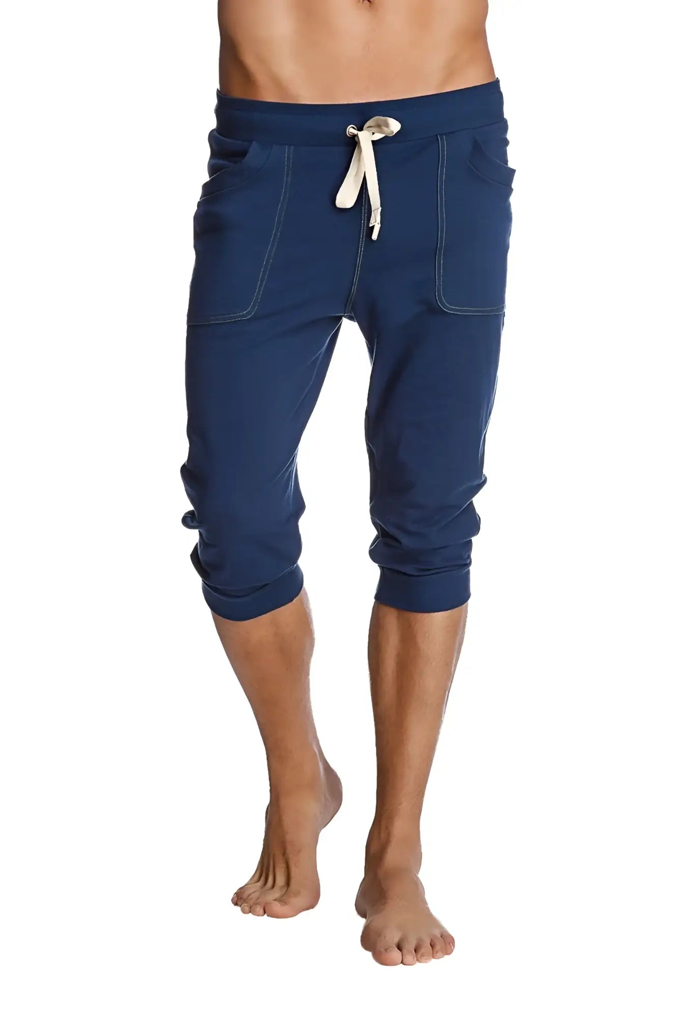Navy blue cropped cuffed yoga pants with white drawstring and stitched pockets for comfortable activewear