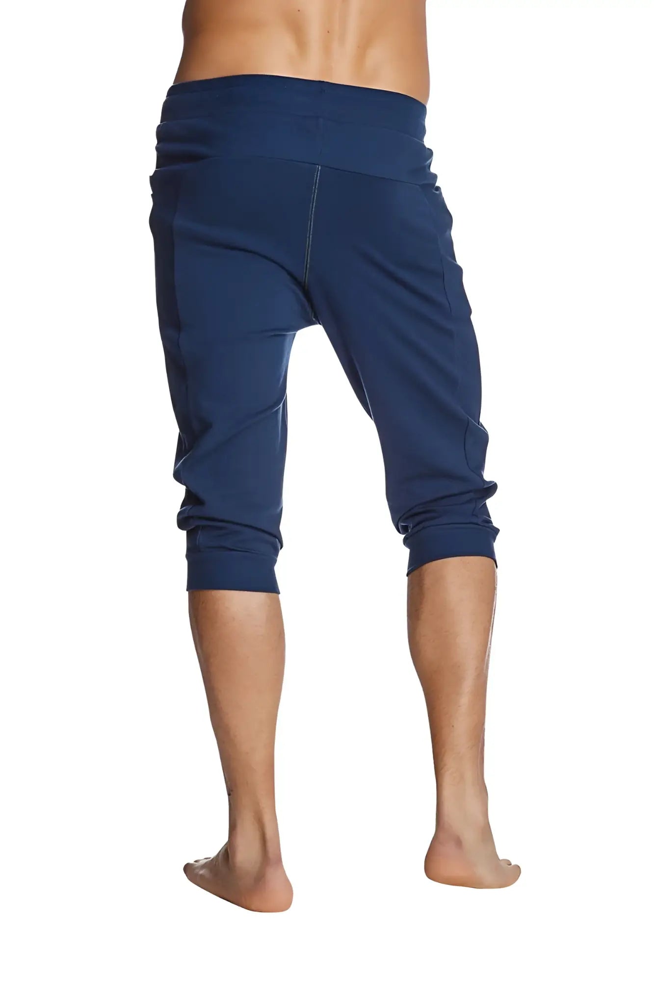 Navy blue cuffed yoga pants with stretchy fabric elastic waistband and rolled cuffs for comfortable activewear