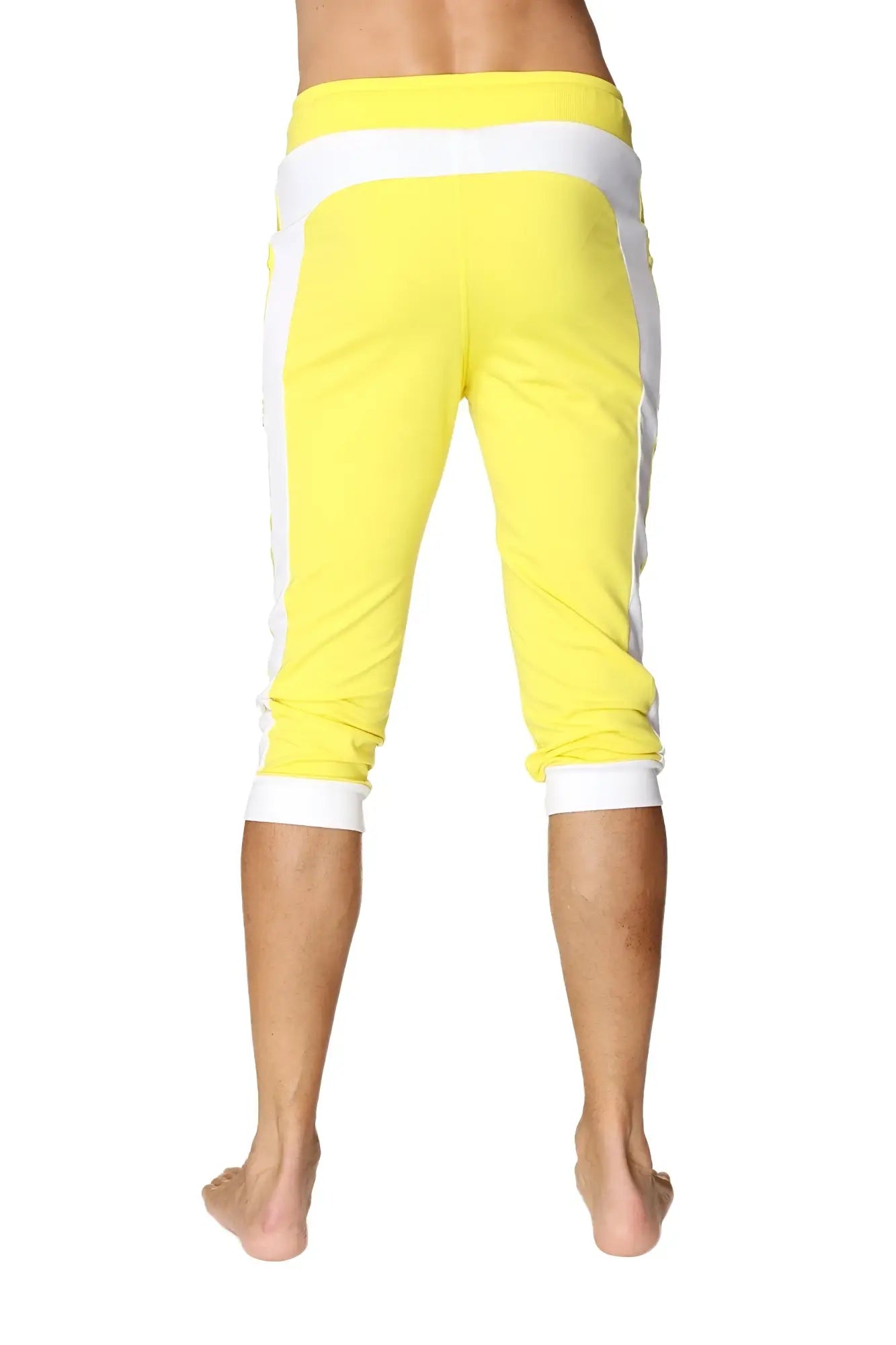 Bright yellow cuffed yoga pants with white side stripes and elastic waistband for comfortable activewear