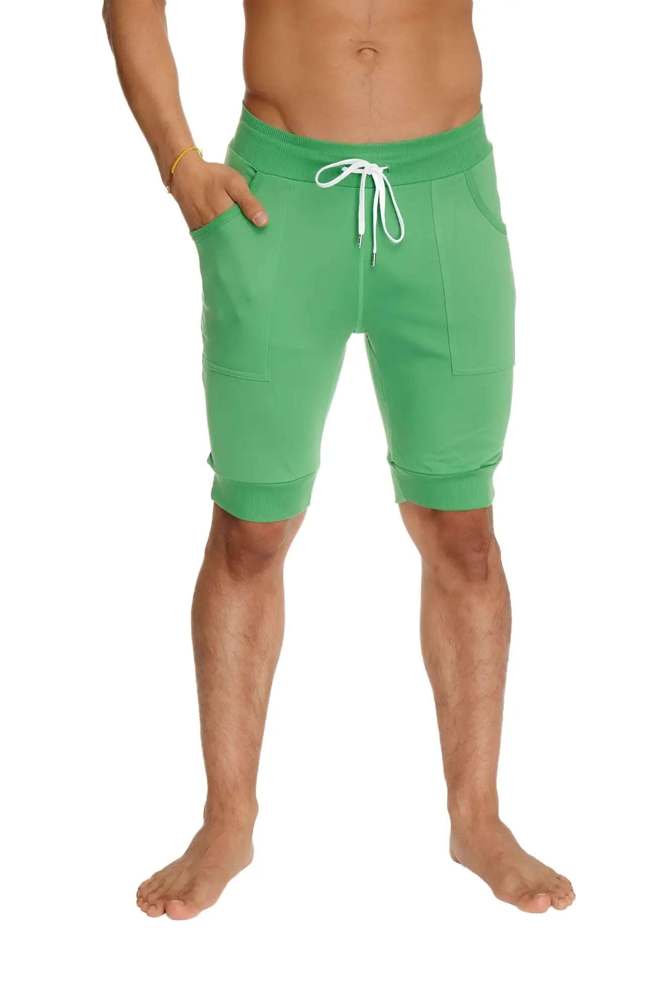 Cuffed yoga short in bamboo green with white drawstring and side pockets designed for athletic use
