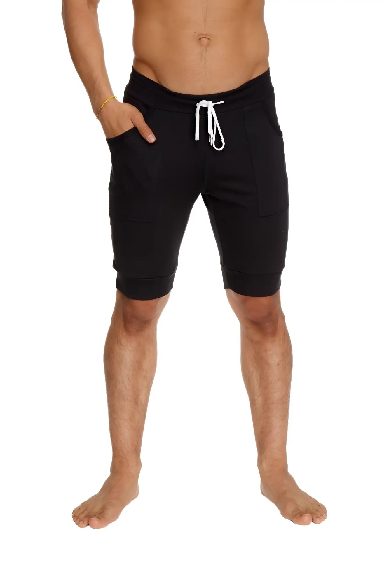 Black cuffed yoga shorts with drawstring, relaxed fit, side pockets, and comfortable fabric for activewear use