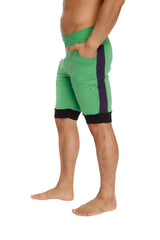 Green cuffed yoga shorts with purple side stripe and black waistband and hem trim for athletic use