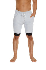 Light gray cuffed yoga shorts with black trim at cuffs and white drawstring waistband for athletic use