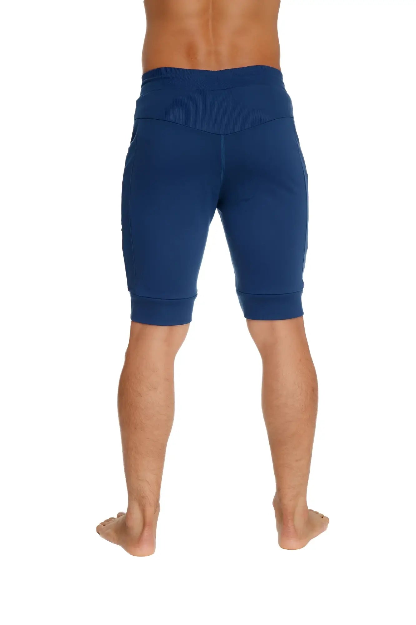 Deep blue high-waisted cuffed yoga shorts with snug fit and elastic cuffs for comfortable athletic wear