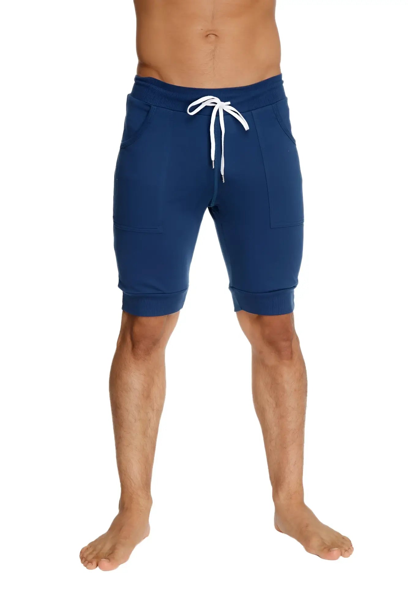 Navy blue cuffed yoga shorts with white drawstring and side pockets designed for comfortable activewear