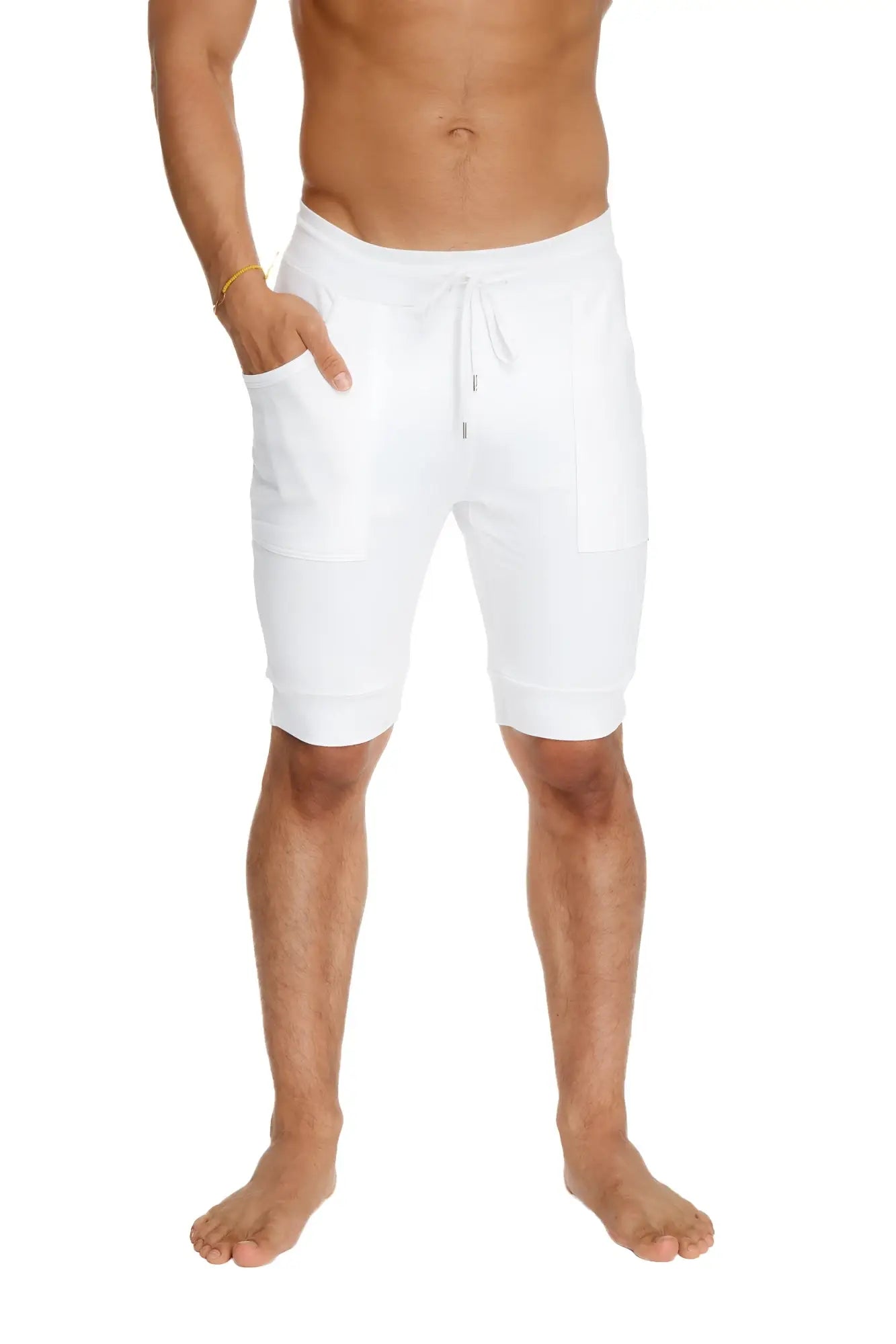 White cuffed yoga shorts with relaxed fit drawstring waistband and side pockets for comfortable wear