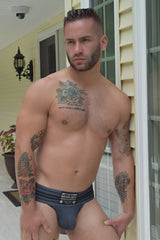 Dark gray textured fabric briefs cumdump jock grey with black label featuring white text front view