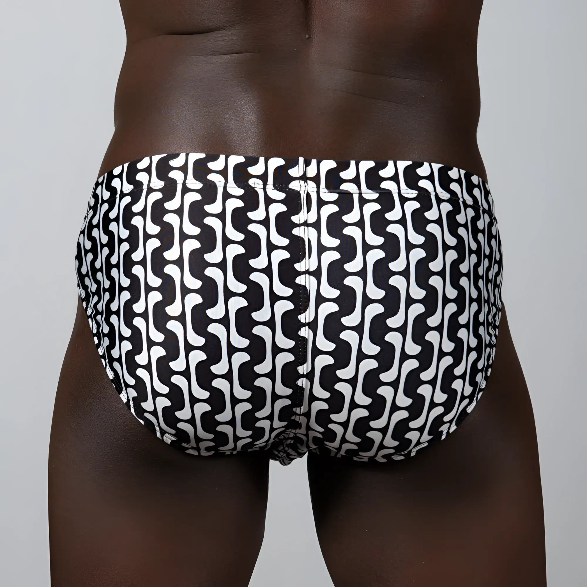 Curves print brief swim trunks with a black and white bold wavy geometric pattern for stylish beachwear