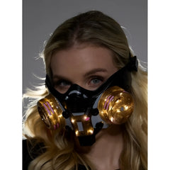 Black and gold cyberpunk light up mask with glowing pink accents on circular filters for futuristic style