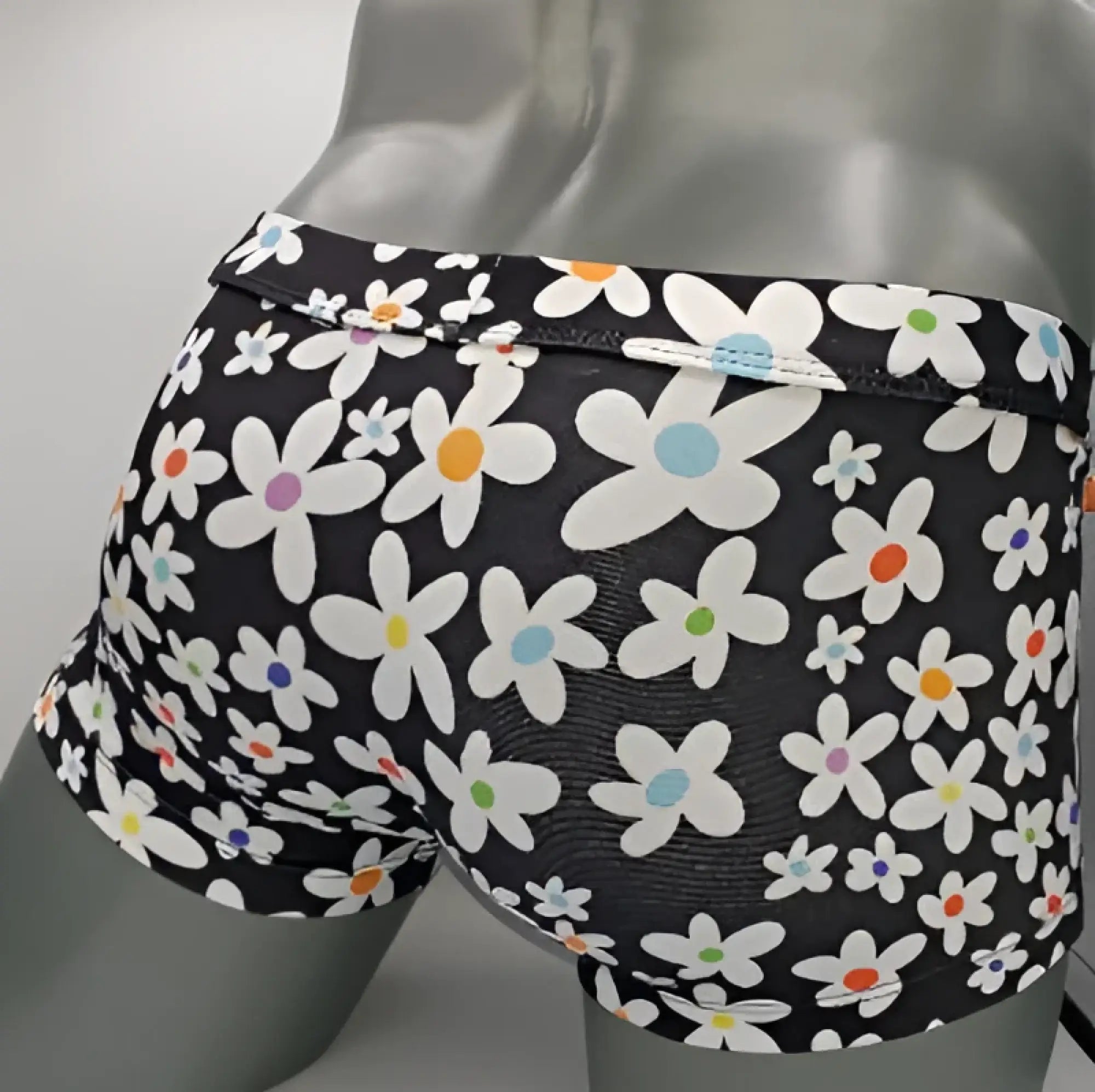 Black briefs daisy sq cut with vibrant white daisies and multicolor centers in pink orange blue and green pattern