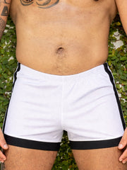 White little boy blue design dan athletic shorts with black side stripes and elastic waistband for boys