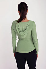 Soft sage green bamboo long sleeve hoodie top with deep scoop neck and draped hooded back shown from the back