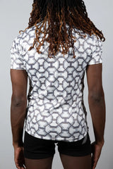 White short-sleeved athletic shirt with a geometric gray pattern designed for performance and style